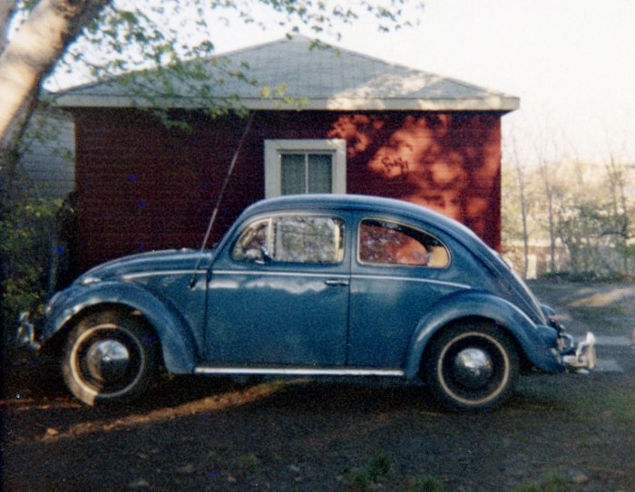 The 1957 VW. Note the antenna, hub caps, and whitewalls.