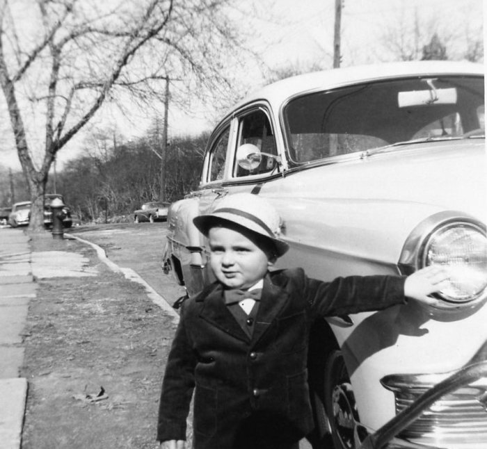 The author, age 2, with Dad's '53 Chevrolet. I had to touch the car.