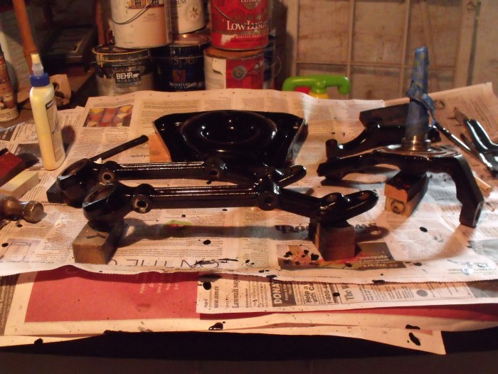 Alfa suspension pieces in various stages of paint