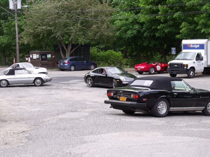 Rally cars queuing up to get a time out for the next segment.