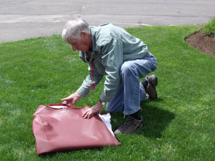 Bob Cushman learns how to fold a British convertible top.