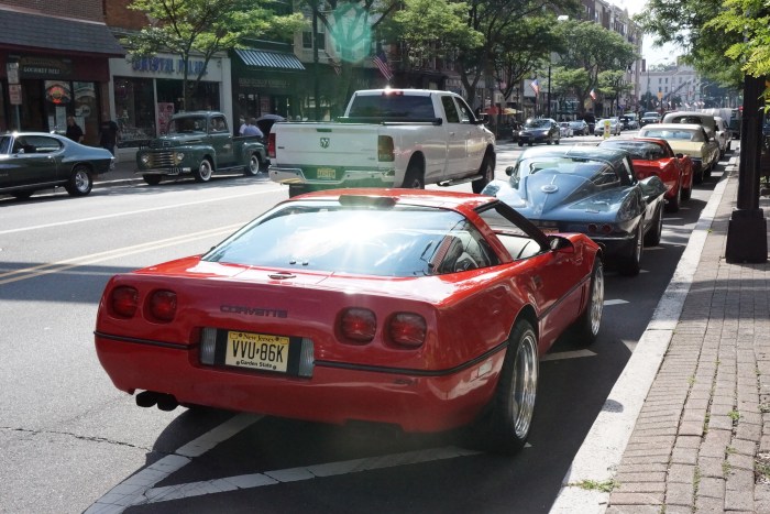 Three different generation Corvettes line up on Main St. 