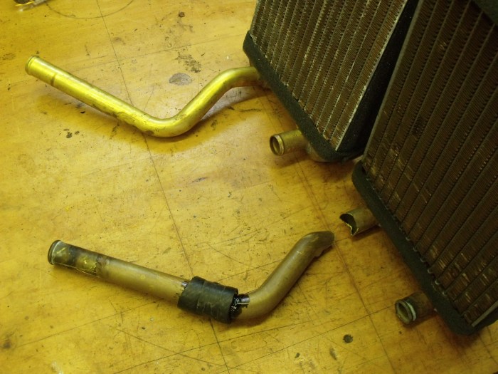 Old (foreground) and new (background) heater cores. Old one has been cut; new one, not yet. 