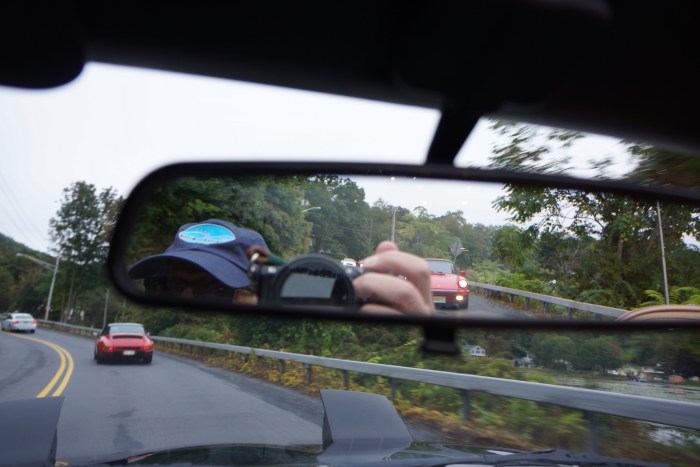 Red Porsche in front, red Porsche in back