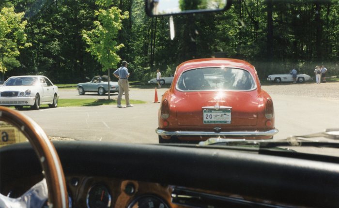 Several of the participating 300SLs are visible in the background