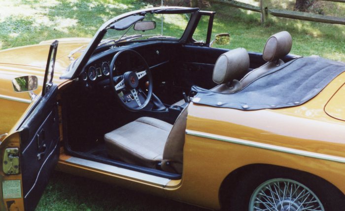 Interior shot shows wheel, seats, and 3rd version of B dash